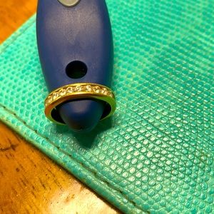 Beautiful 18K Gold ring with diamonds on top.